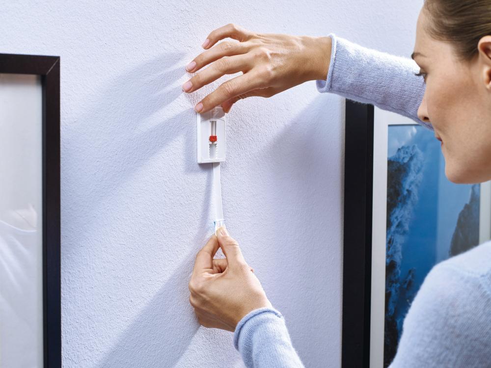 Tesa - Verstellbarer selbstklebender Nagel für alle Wandarten (max. 2x2kg)