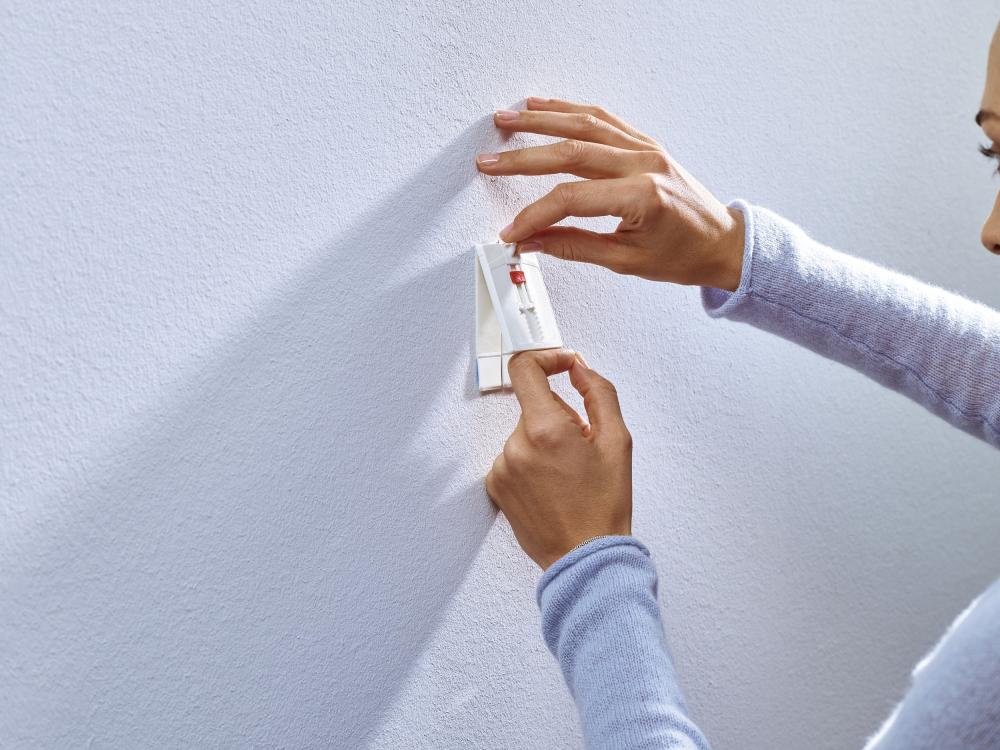 Tesa - Verstellbarer selbstklebender Nagel für alle Wandarten (max. 2x2kg)